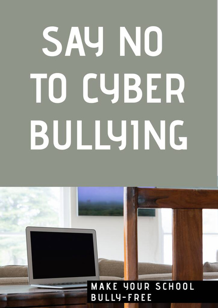 Digitally generated image of say no to cyber bullying text against laptop on grey background. cyber bullying template design concept - Photo, image