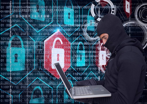 Composition of binary coding and online security padlocks over hacker in hood using laptop. online security cyber attack concept digitally generated image. - Photo, Image