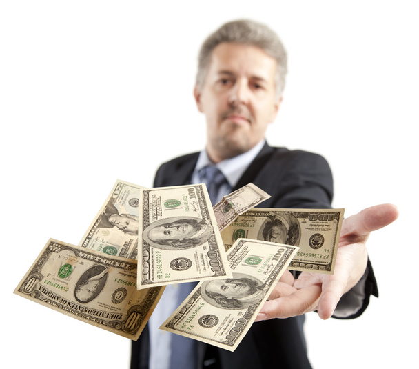 Businessman throwing dollar - Zdjęcie, obraz