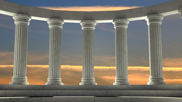 Antiguos pilares de mármol en disposición elíptica con cielo naranja
 - Foto, Imagen