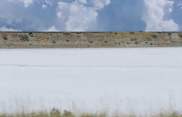 White expanse of salt lake along the highway in Utah. - Photo, Image