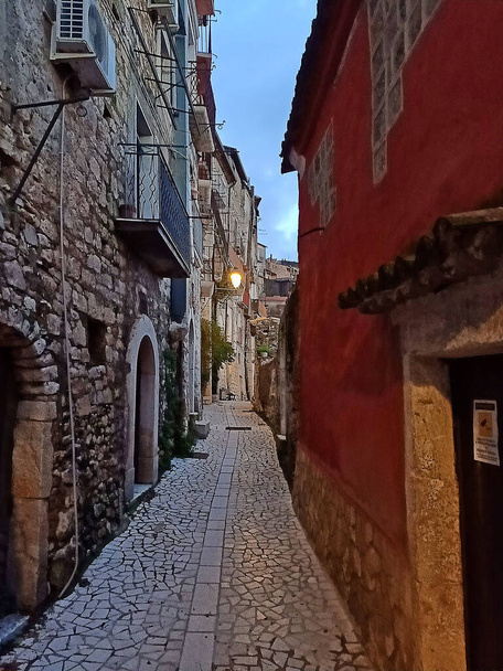 A narrow street between the old houses of Guardia Sanframondi, a mountain village in the province of Benevento, Italy. - Photo, Image
