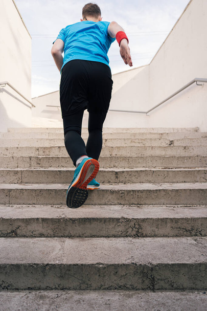 Young man practicing interval workout on stairs - Photo, Image
