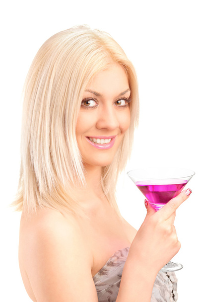 A beautiful woman drinking a cocktail - Photo, image