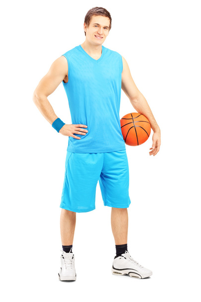 Male basketball player holding ball - Foto, afbeelding