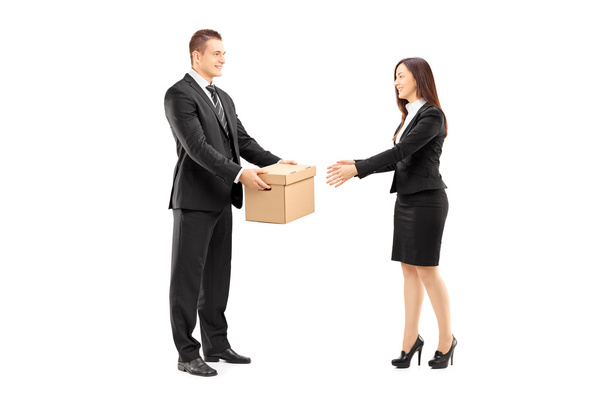 Businessman giving box to colleague - Foto, Imagen