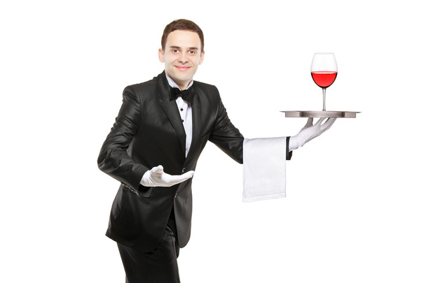Waiter holding tray with glass of wine - Foto, Bild