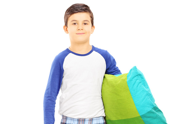 Boy in pajamas holding pillow - Foto, imagen