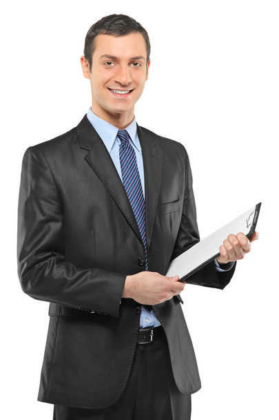 Businessman holding clipboard - Fotó, kép