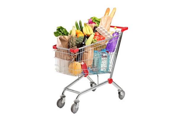 Shopping cart with various groceries - Fotoğraf, Görsel