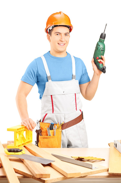 Manual worker holding hand drilling machine - Zdjęcie, obraz