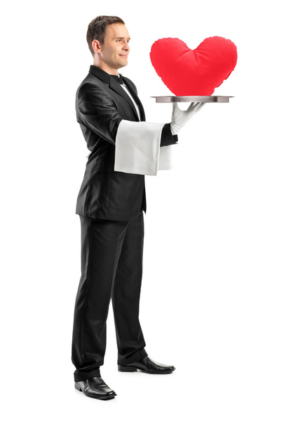 Waiter holding tray with heart shape - Foto, afbeelding