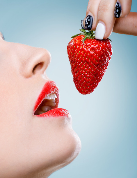 Women's mouth eats strawberries - Photo, Image