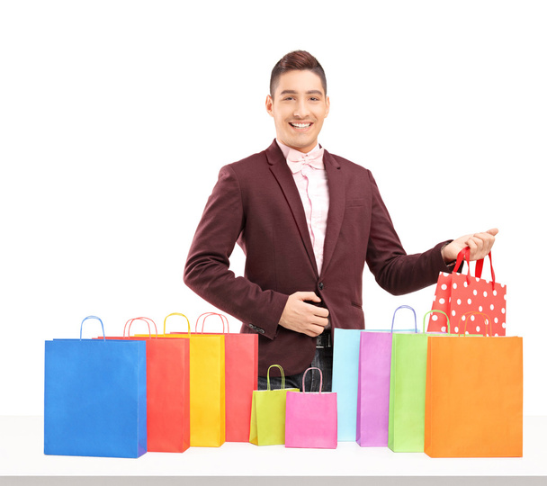 Man with many shopping bags - Фото, зображення