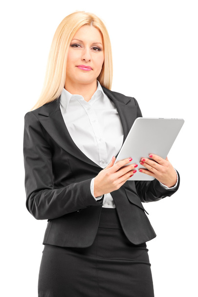 Smiling businesswoman holding tablet - Фото, изображение