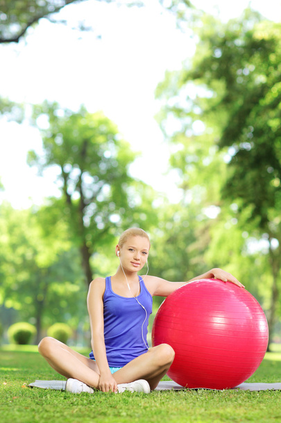 Female sitting with fitness ball - Photo, Image