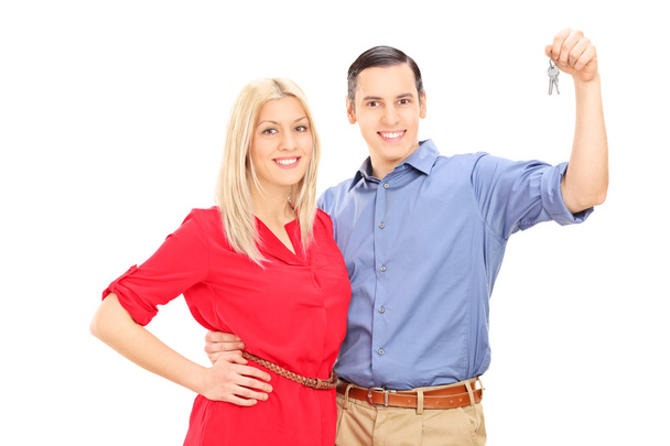 Happy young couple holding keys  - Foto, Imagen