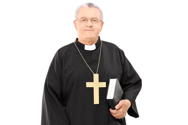 Mature priest holding bible - Фото, зображення