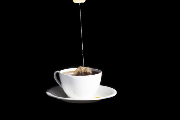 White cup on a black background - Foto, Imagem