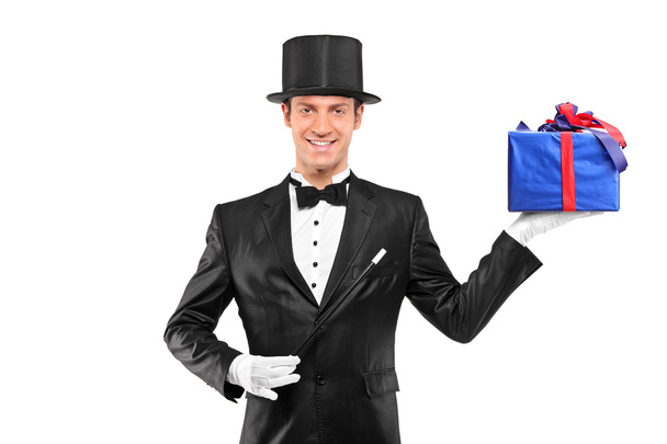 Magician holding gift - Foto, afbeelding