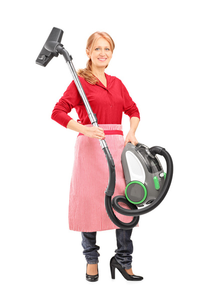 Woman holding vacuum cleaner - Foto, imagen