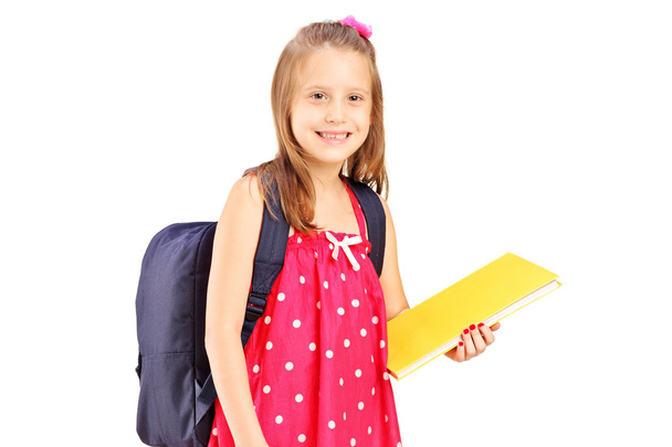 School girl holding notebook - Foto, afbeelding