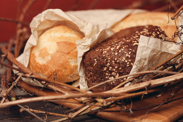 flour product loaf of bread baked goods on the branches of the nest close-up - Фото, зображення