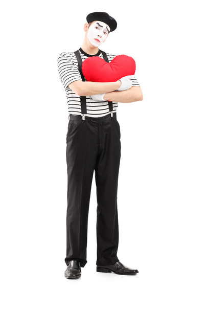 Sad mime artist holding red heart - Foto, afbeelding