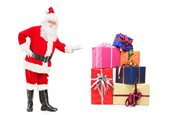 Santa claus oferuje prezenty - Zdjęcie, obraz
