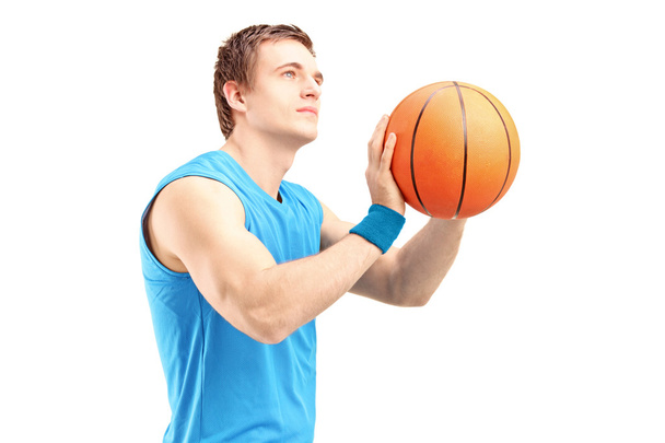 Basketball player shooting basketball - Zdjęcie, obraz