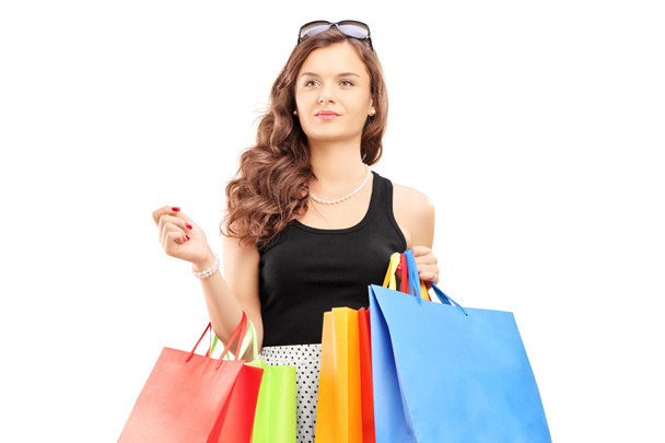 Young woman walking with shopping bags - Zdjęcie, obraz