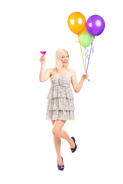Girl holding a cocktail and balloons - Φωτογραφία, εικόνα