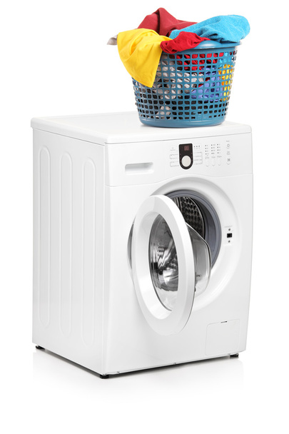 Laundry basket on washing machine - Foto, afbeelding