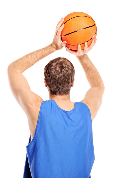 Basketball player aiming to shoot ball - Fotó, kép