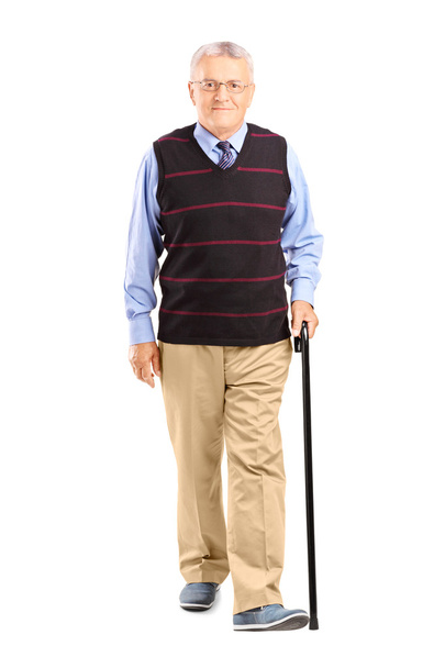Senior man walking with cane - 写真・画像