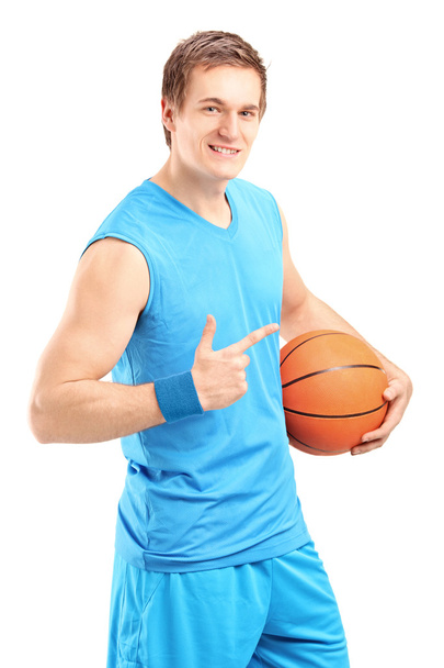 Basketball player holding ball - Photo, image