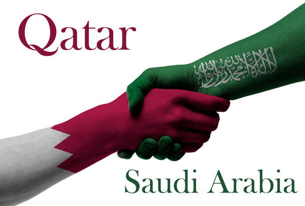 Qatar ja Saudi-Arabia - lippu kädet symboloivat yhteistyötä ja ystävyyttä - Valokuva, kuva
