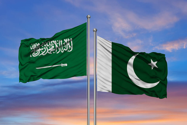 Saudi-Arabien und Pakistan, zwei Flaggen wehen vor blauem Himmel. 3d imag - Foto, Bild