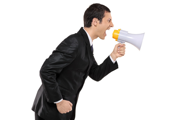 Businessman shouting via megaphone - Foto, Bild