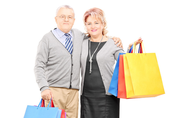 Man and woman holding shopping bags - Fotoğraf, Görsel