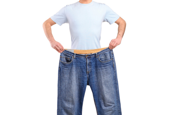 waga strata męskiego wyświetlone stare dżinsy - Zdjęcie, obraz
