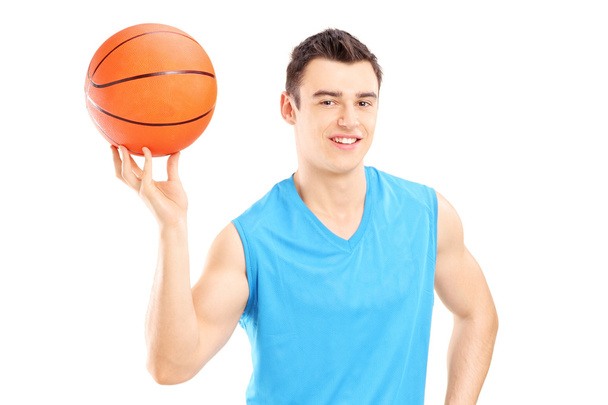 Basketball player holding basketball - Fotoğraf, Görsel