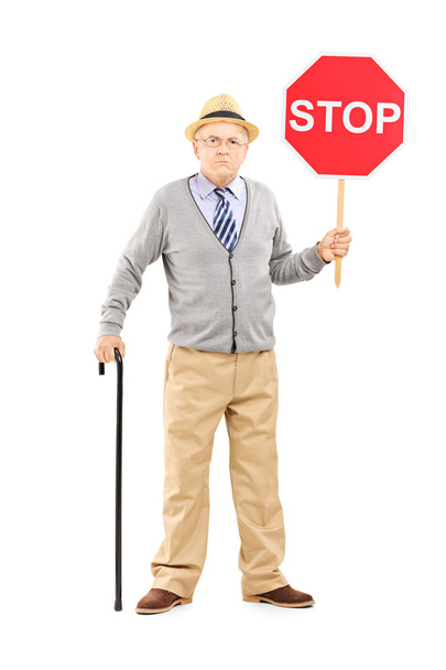 Mature gentleman holding stop sign - Fotó, kép