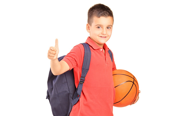Schoolboy with basketball giving thumb - Fotografie, Obrázek