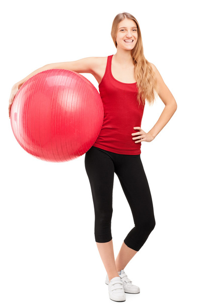 Female athlete holding pilates ball - Φωτογραφία, εικόνα