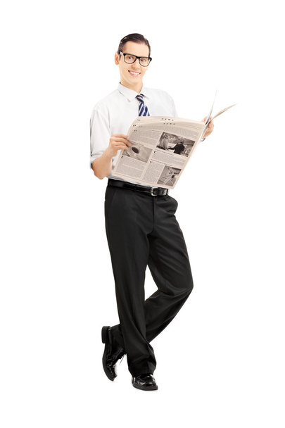 Businessman holding newspaper - Zdjęcie, obraz