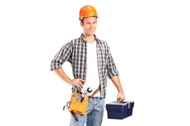 Trabajador sosteniendo una llave inglesa y un toolbo
 - Foto, Imagen