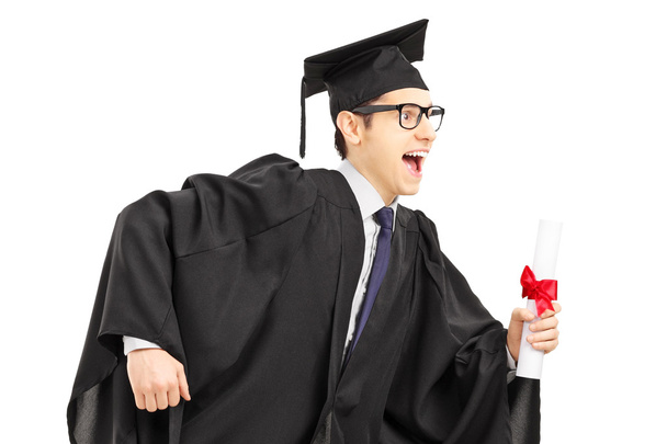 Student running and holding diploma - Photo, Image