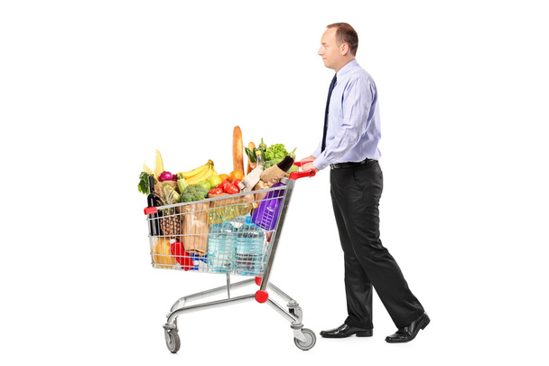 Person pushing shopping cart - Photo, Image