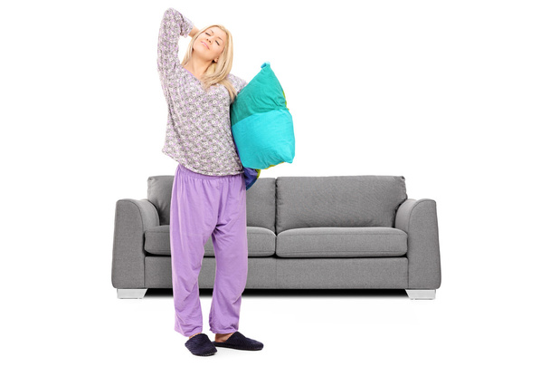 Woman in pajamas stretching - Zdjęcie, obraz